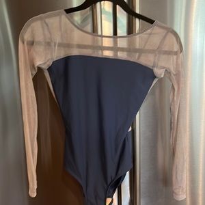 Blue long sleeve Eleve leo with slight design on the mesh sleeves.